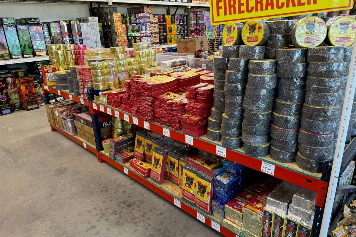 Firecracker Street, with rolls of firecrackers stacked on the shelves