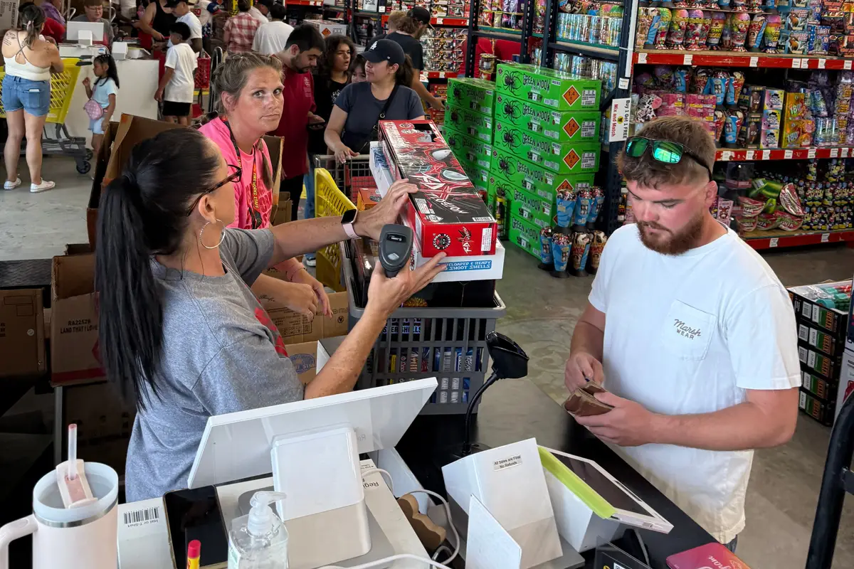 Cashiers ringing up orders on the 4th of July