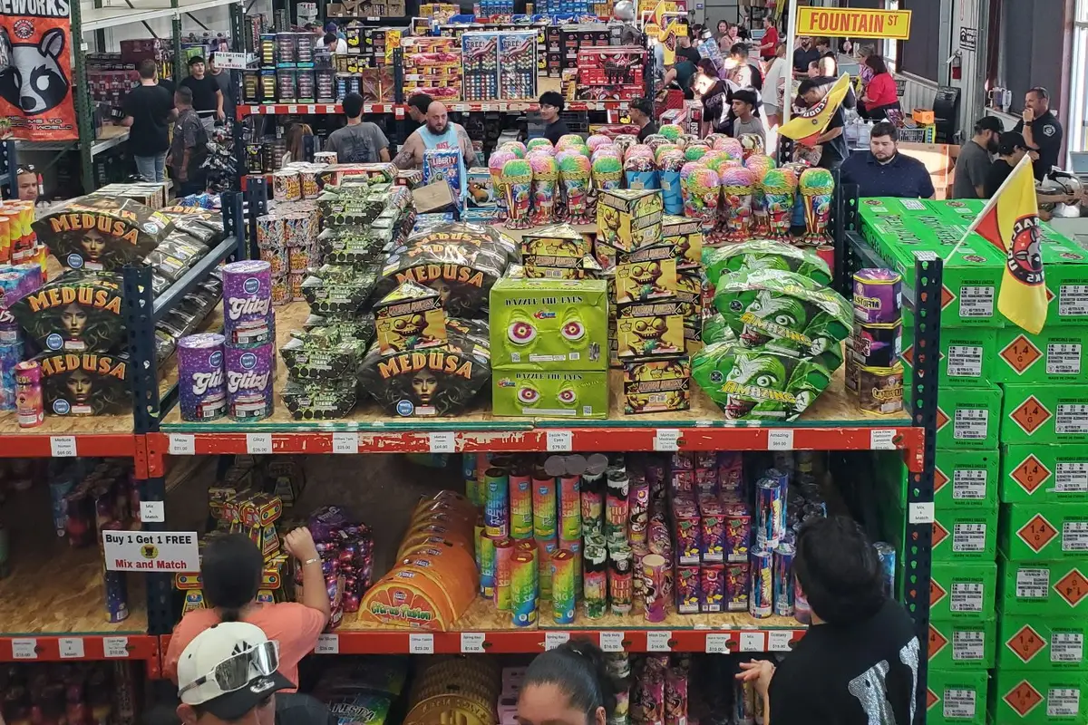 A crowd shopping the cake aisle on the 4th of July