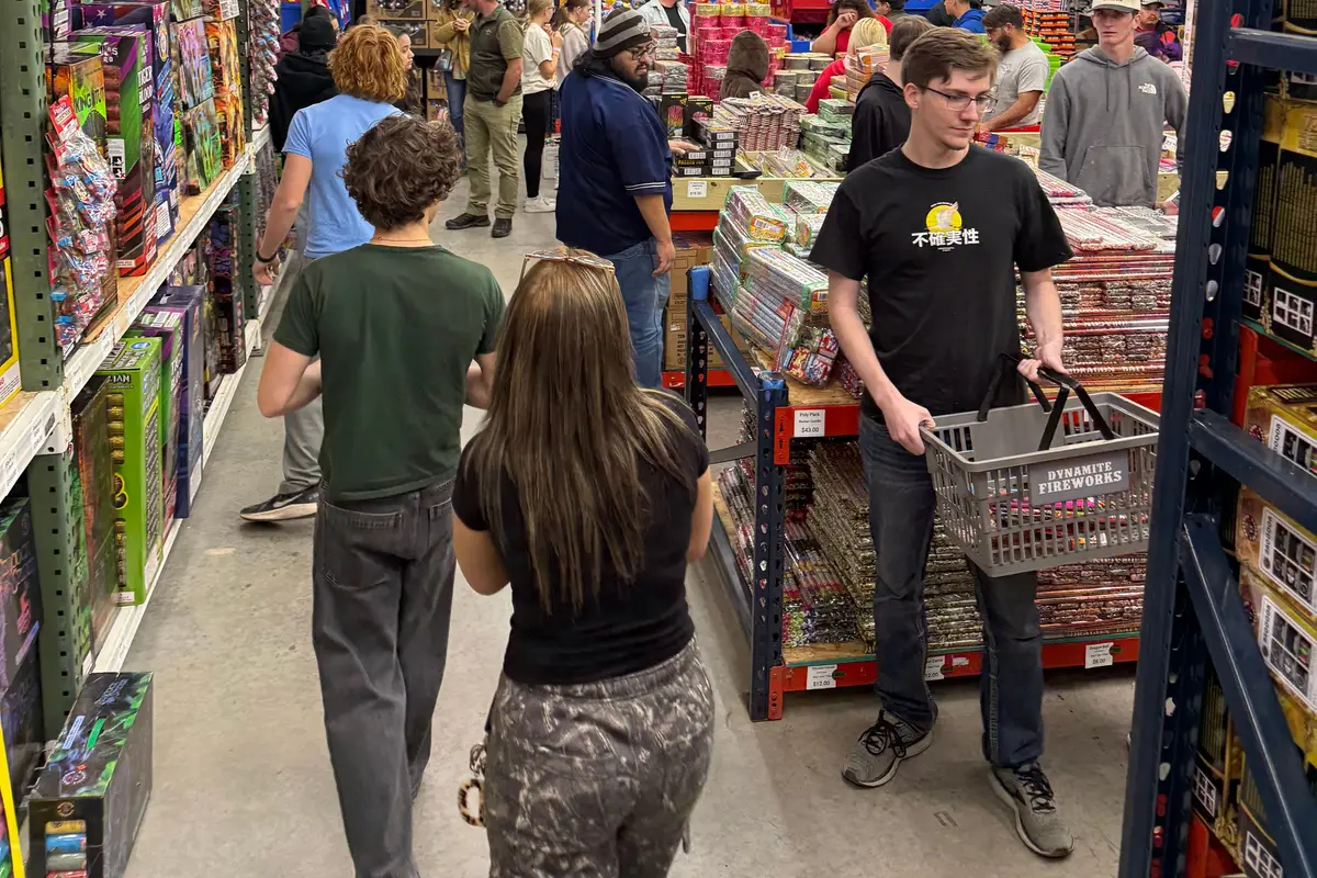 Shoppers walking an aisle on New Year's Eve