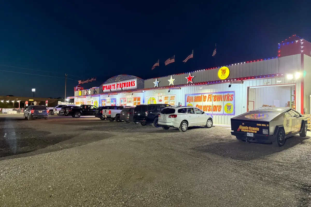 Dynamite Fireworks Superstore lit up at night in Caddo Mills, Texas