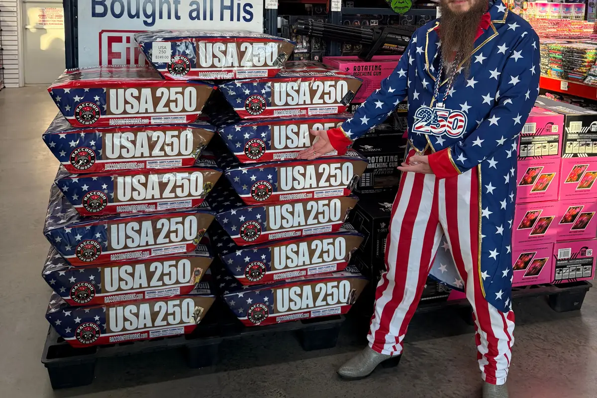 Uncle Sam next to the USA 250 cake display
